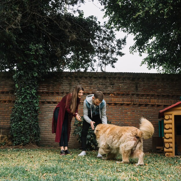 Young couple with cute dog