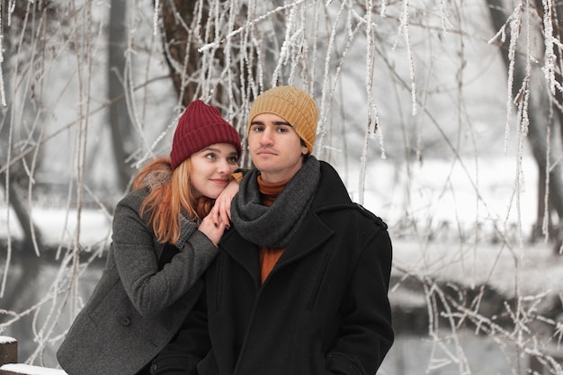 Young couple with dreamy woman and serious man