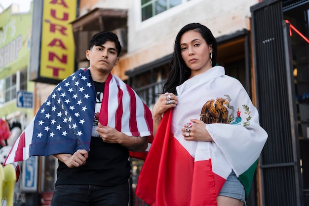 Young couple with flags on the street