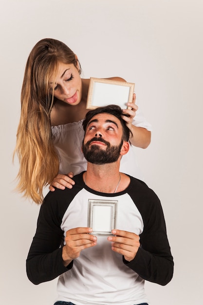 Young couple with frames