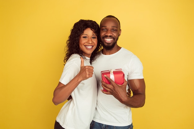 Young couple with red present