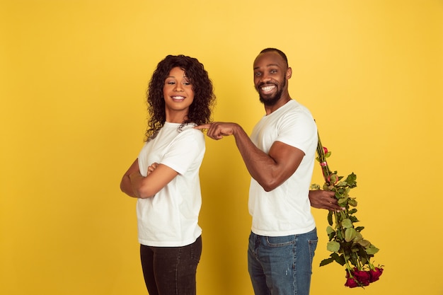 Free photo young couple with roses