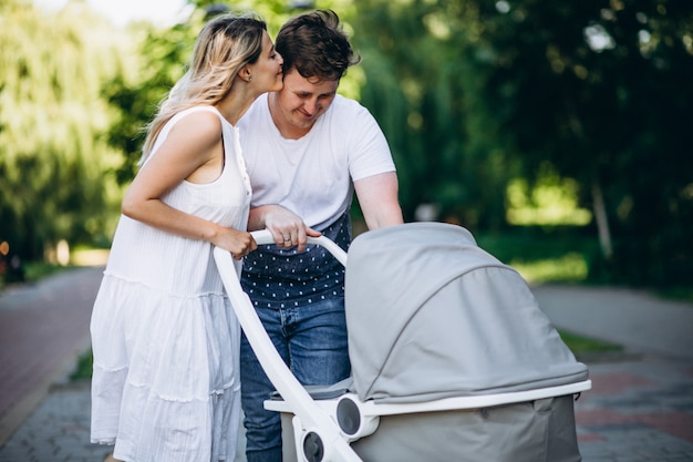 Free photo young couple with their baby daughter in park