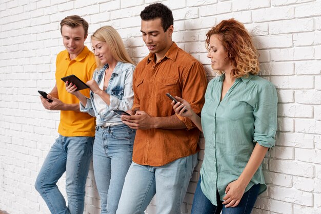 Young couples together with smartphones