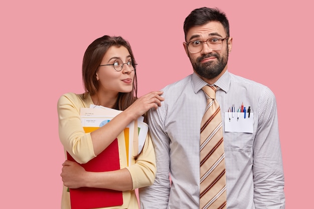 Free photo young coworkers in formal clothes