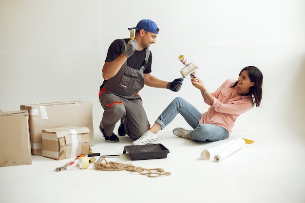 The young and cute family repairs the room