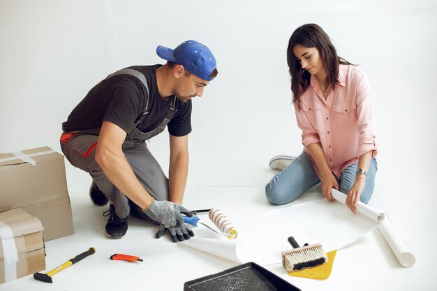 The young and cute family repairs the room