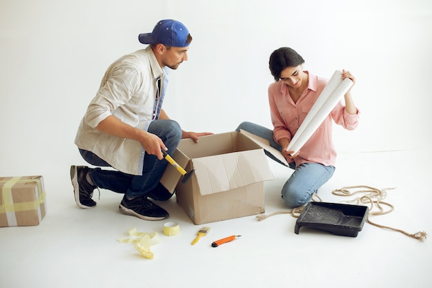 The young and cute family repairs the room