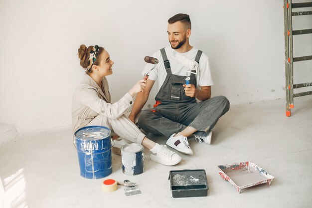 The young and cute family repairs the room