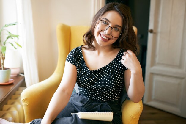 Young cute female posing indoor