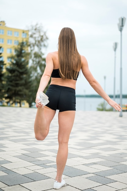 Free photo young cute woman doing sports long shot