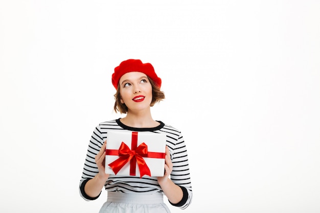 Free photo young cute woman holding gift surprise box.