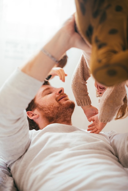 Young dad playing with child