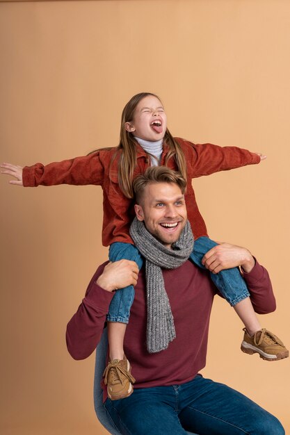 Young daughter and father excited for their travel vacation