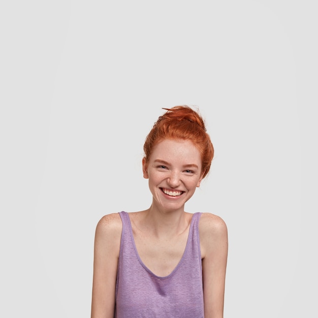 Free photo young delighted pretty ginger female has freckled skin