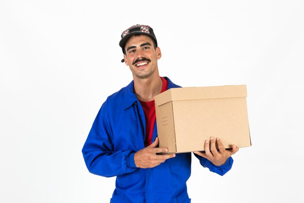 Young deliveryman with box