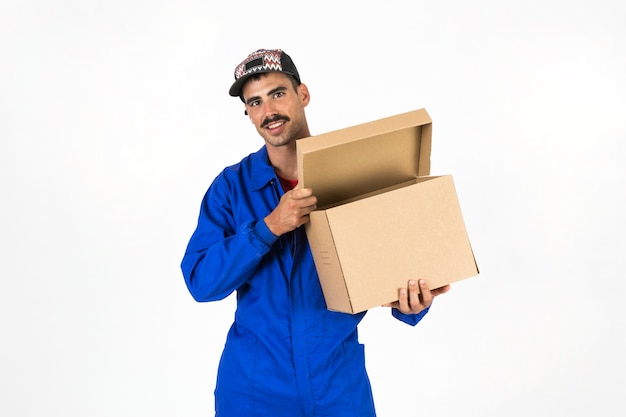 Free photo young deliveryman with box