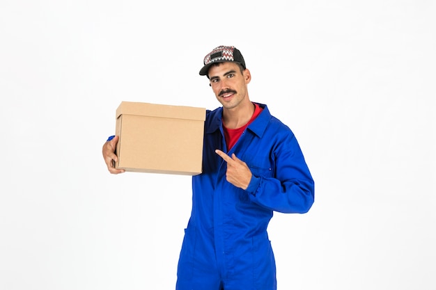 Young deliveryman with box