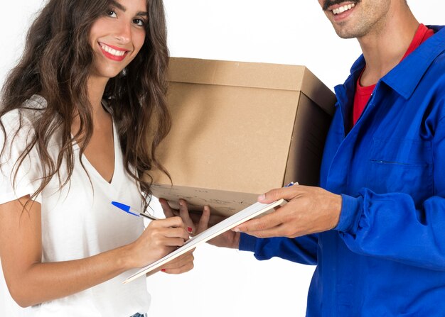 Young deliveryman with box