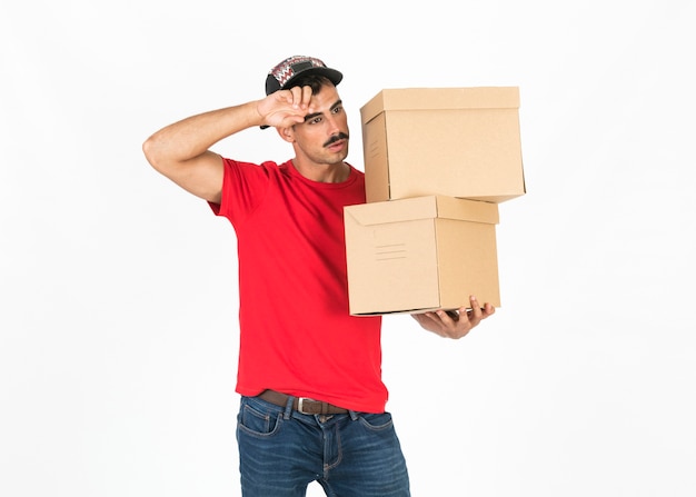 Free photo young deliveryman with boxes