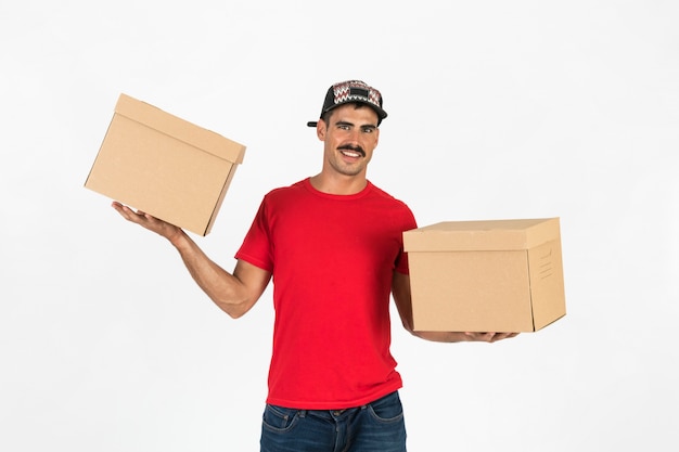 Young deliveryman with boxes