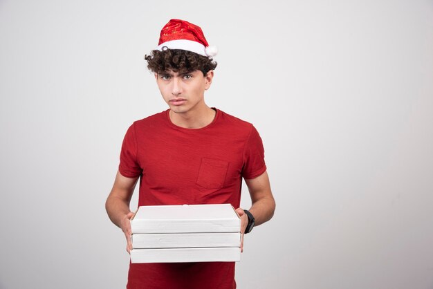 young deliveryman with pizza boxes  
