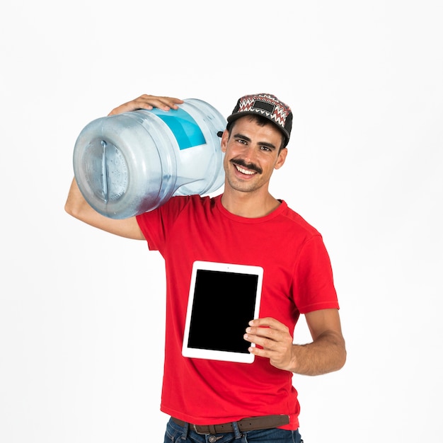 Young deliveryman with water carafe