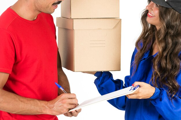 Young deliverywoman with boxes