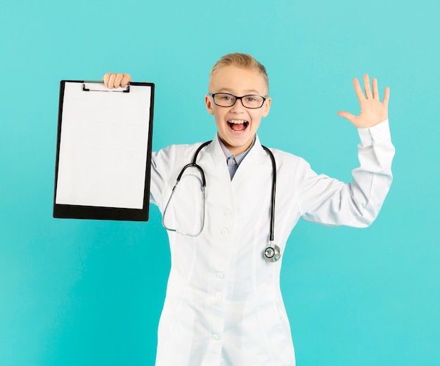 Free photo young doctor holding blank clipboard