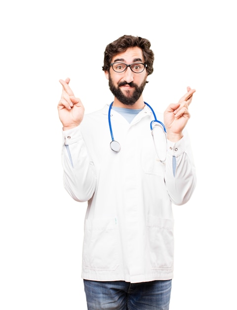 young doctor man finger cross sign