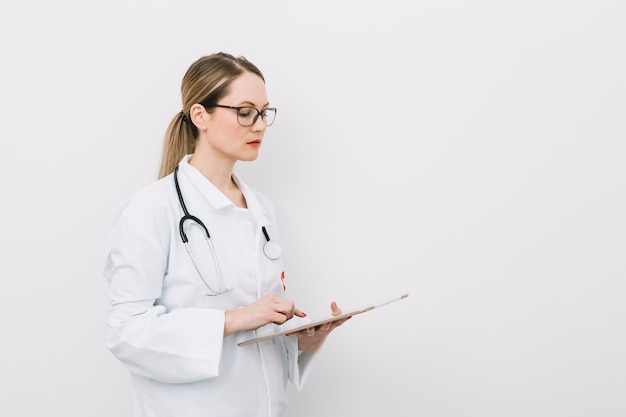 Young doctor with clipboard