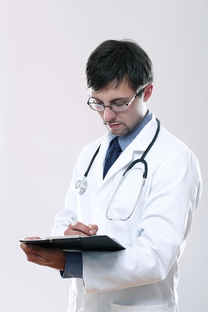 Young doctor with stethoscope and clipboard