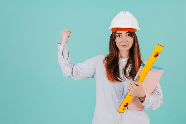 Young draftswoman showing biceps