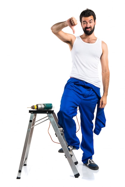 Young electrical technician with a drill doing bad signal