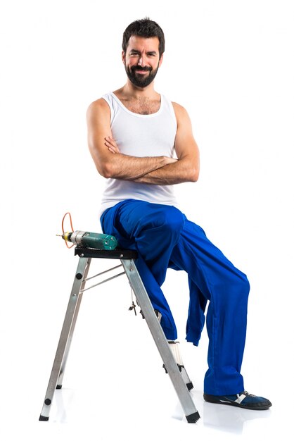 Young electrical technician with a drill