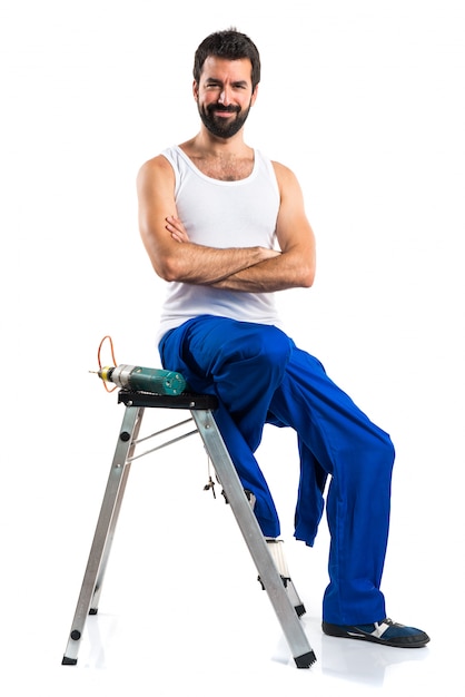 Young electrical technician with a drill