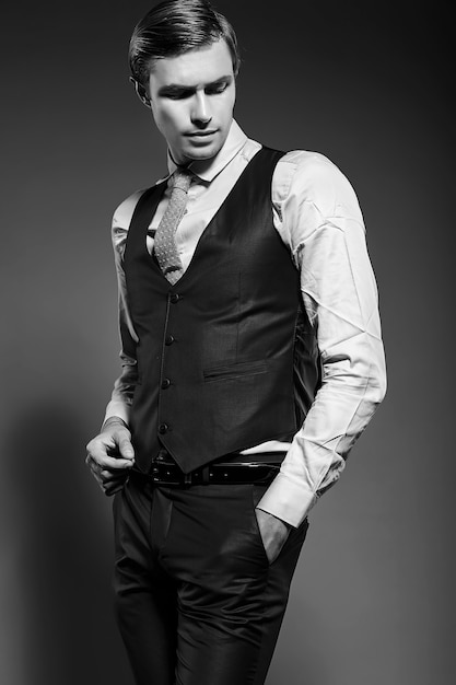 Young elegant handsome businessman male model in blue suit