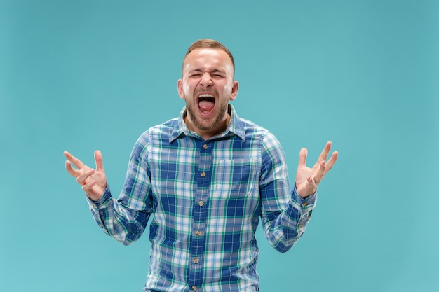 The young emotional angry man screaming