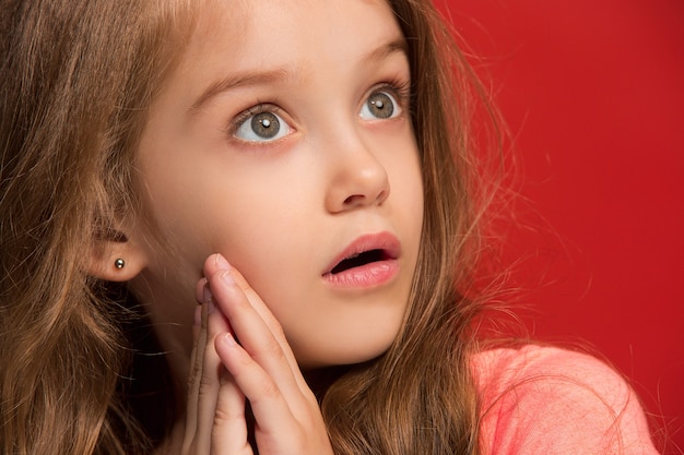 Young emotional surprised girl standing with open mouth