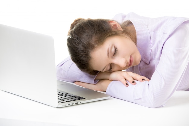 Young employee sleeping while working