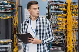 Free photo young engineer in server room