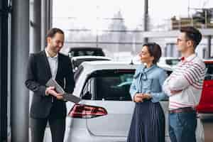 Free photo young family buying a car