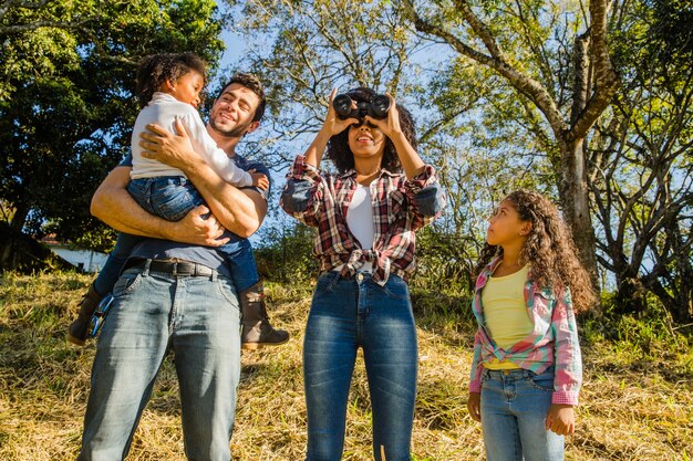 Young family in front of hill