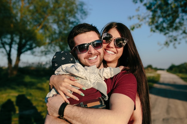 Young family have fun and relaxing outdoors in the countryside