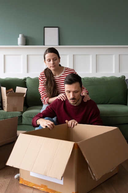 Free photo young family moving into a new home