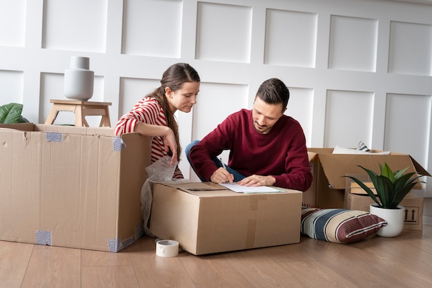 Free photo young family moving into a new home