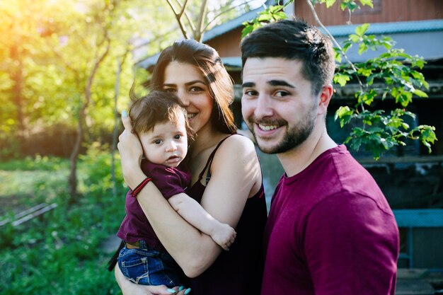 Young family on the nature in the countryside