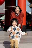 Free photo young family spending time with their toddler