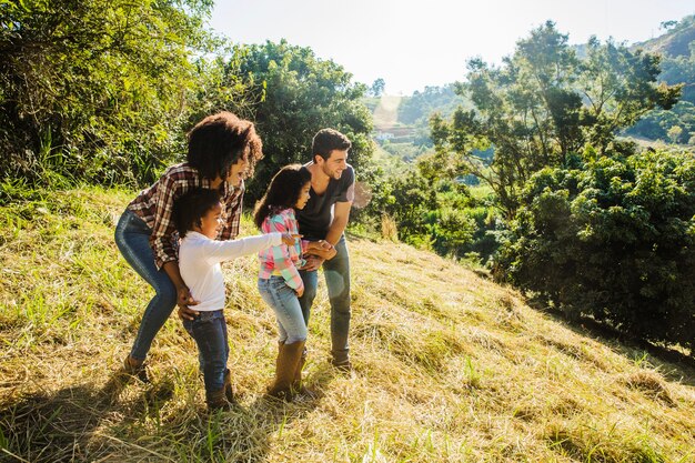 Young family on sunny hill