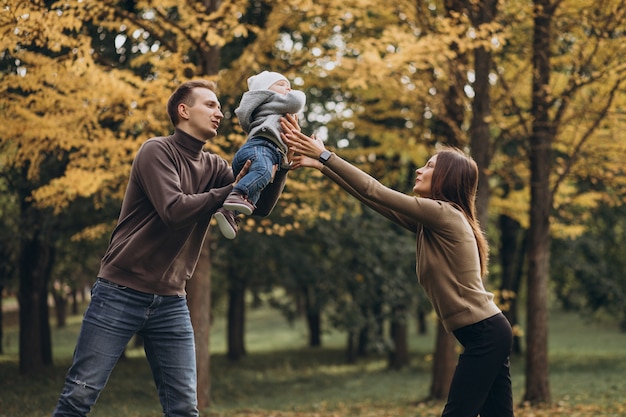 Young family with baby son in park